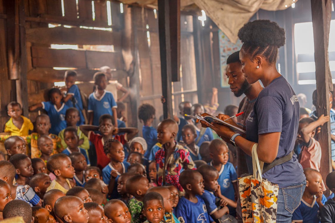 Charity work - volunteers teaching children